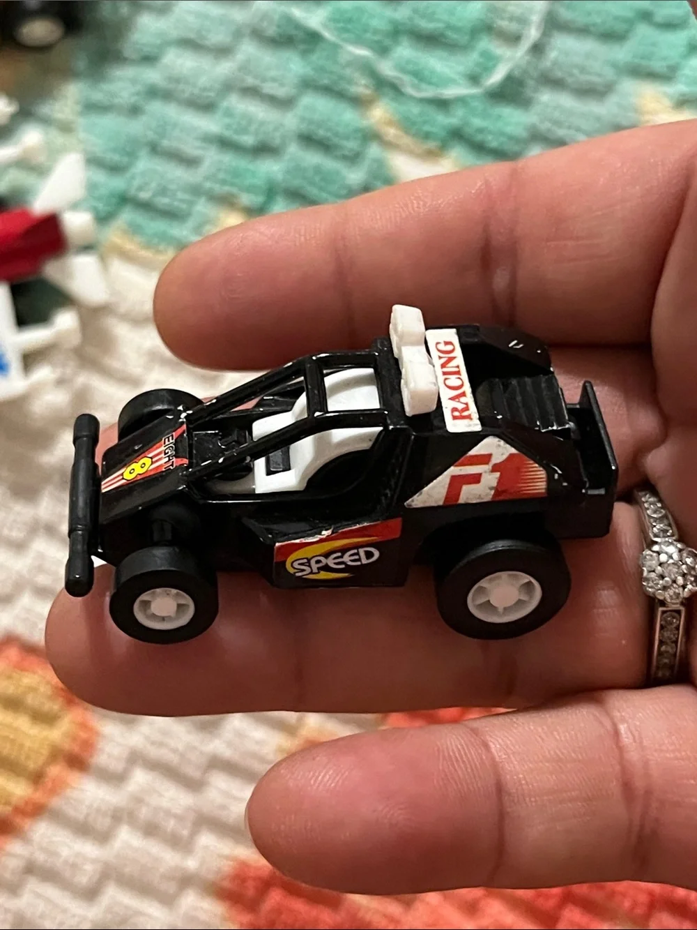 Vintage Red & White Toy Jet with Yellow and Black Race Cars
